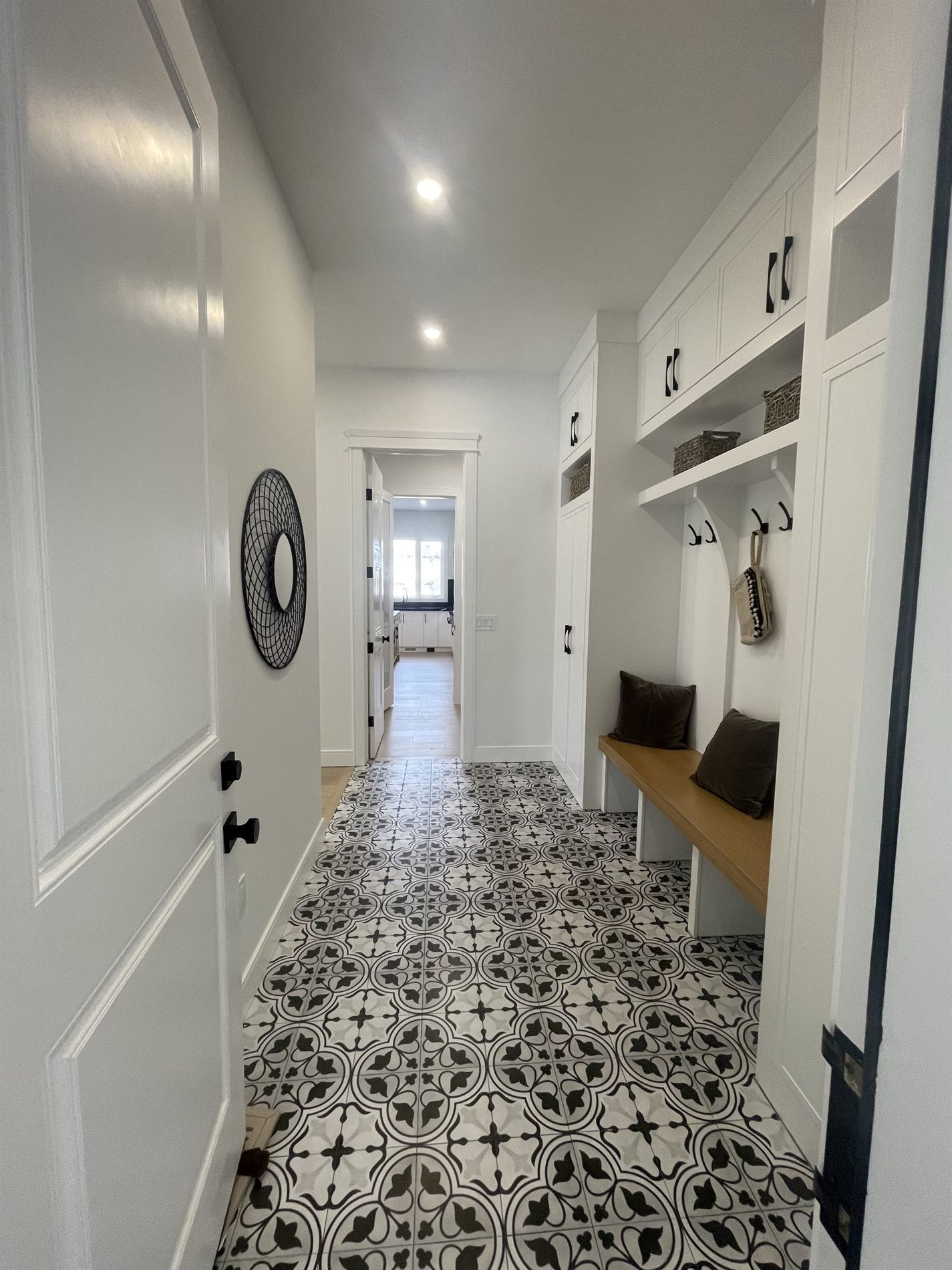 Entry hallway with a patterned tile floor