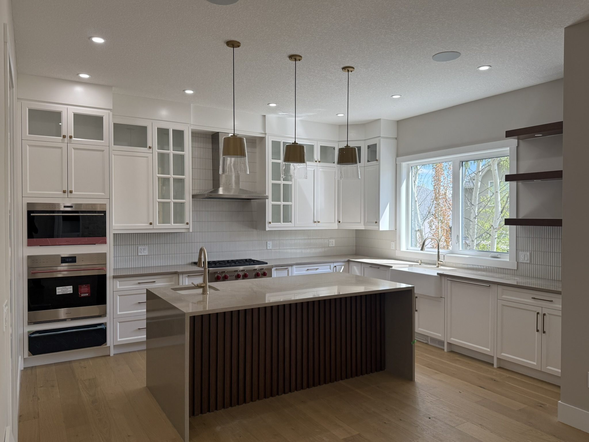 Kitchen with a wide island and pendant lighting