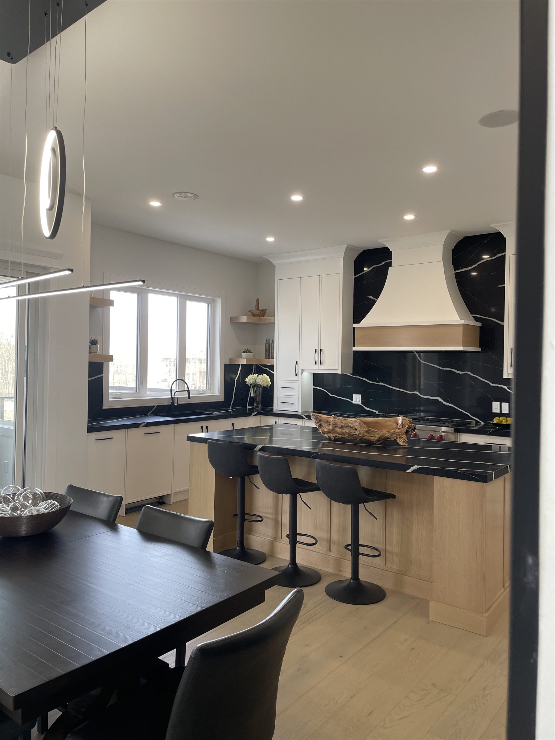 Kitchen with a black waterfall island